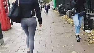 UK candid sexy fit Indian in leggings teasing and grinning