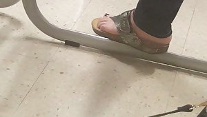 Girl flashes soles in class