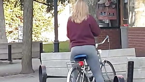 Grey tights on bike blonde teen
